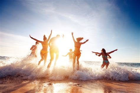 Beachgoers Form Lines At The Beach For Summer Fun